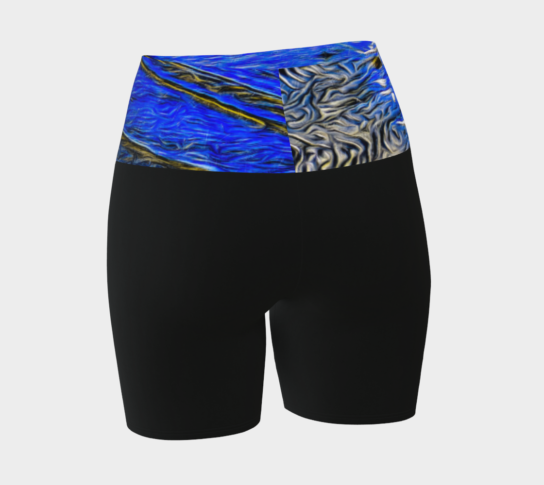 Ebb and Flow Yoga shorts feature a image of the ocean water at low tide with the sky and the sun reflecting on the water. This image is printed on the band of the yoga shorts.  The bottom of the shorts are black.