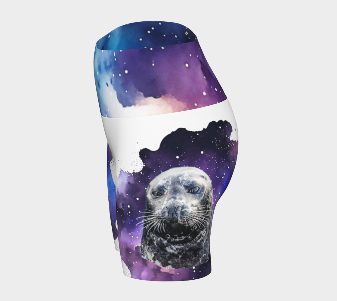 I Love Lucy Yoga shorts. All over print with a colourful celestial  abstract and a image of a harbour seal named Lucy.  The shorts are white with the image printed on it plus the band.