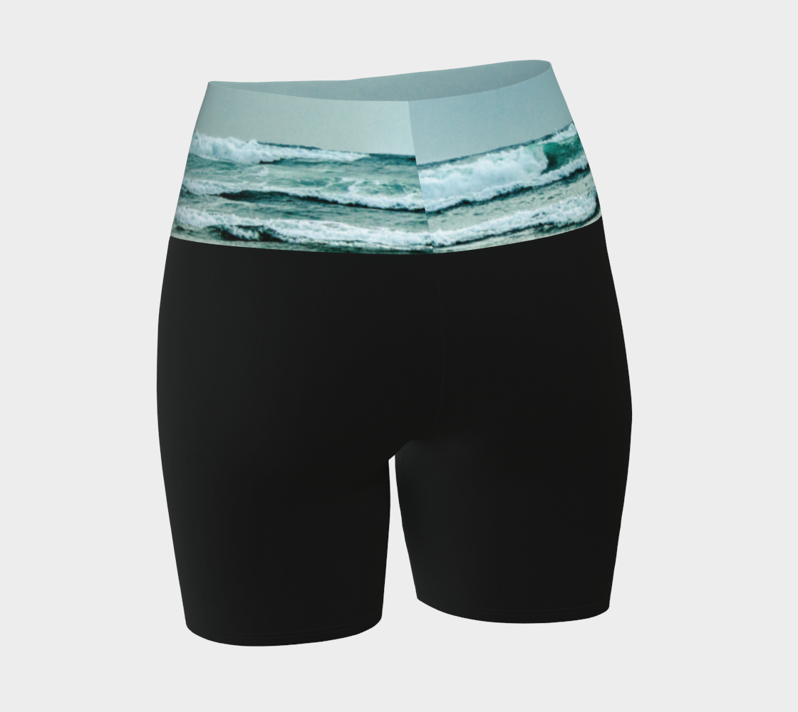 Ocean Calling Long Beach Tofino Yoga shorts.  The image of the ocean waves is printed on the waistband. The rest of the shorts is black.