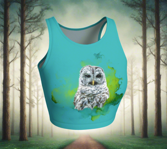 Wise owl active crop top features a barred owl with a green abstract background printed on a turquoise top.