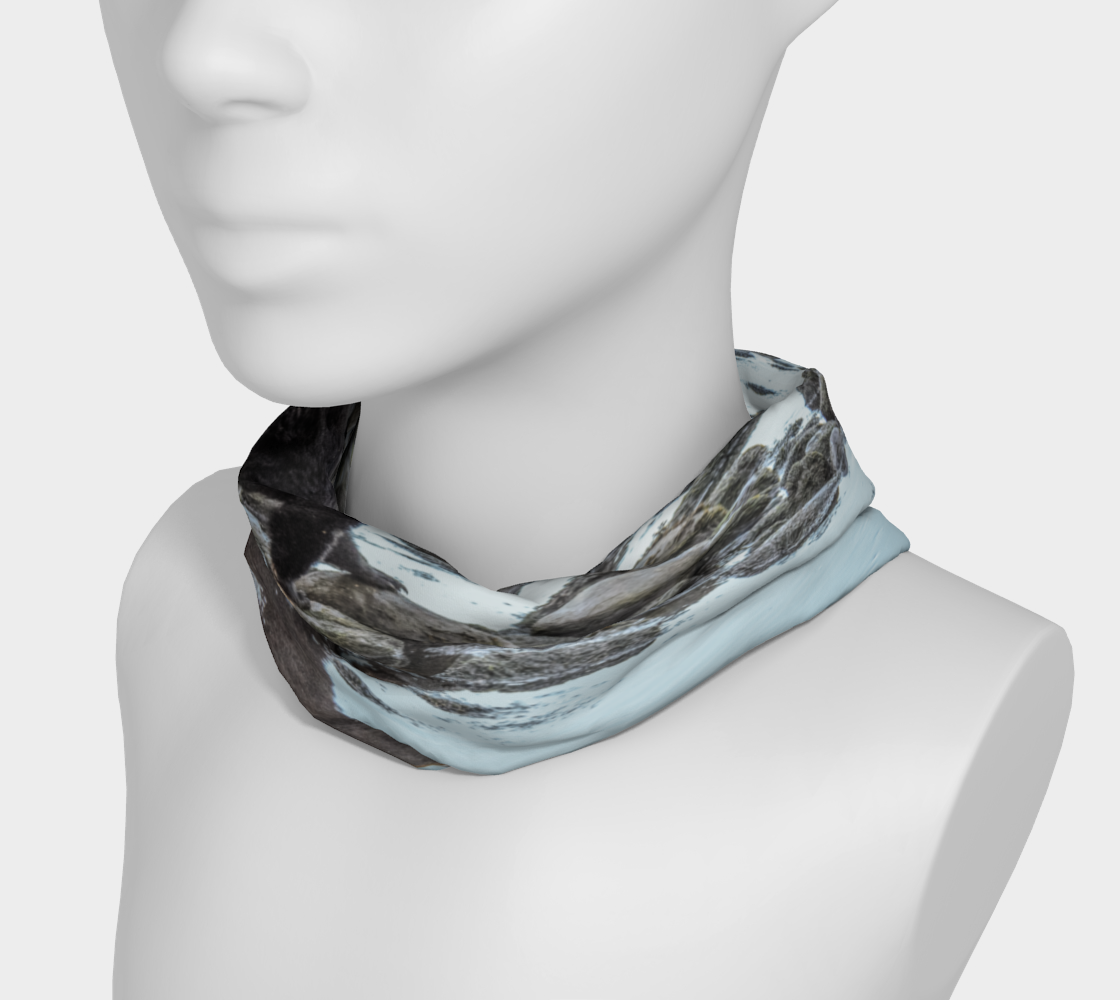 Headband and or neck gaiter with a image of a bear and its reflection as it crosses a creekbed.