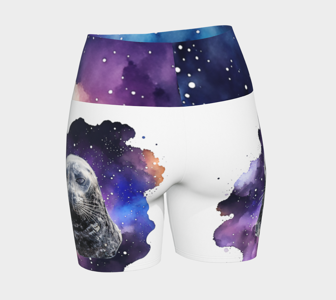 I Love Lucy Yoga shorts. All over print with a colourful celestial  abstract and a image of a harbour seal named Lucy.  The shorts are white with the image printed on it plus the band.