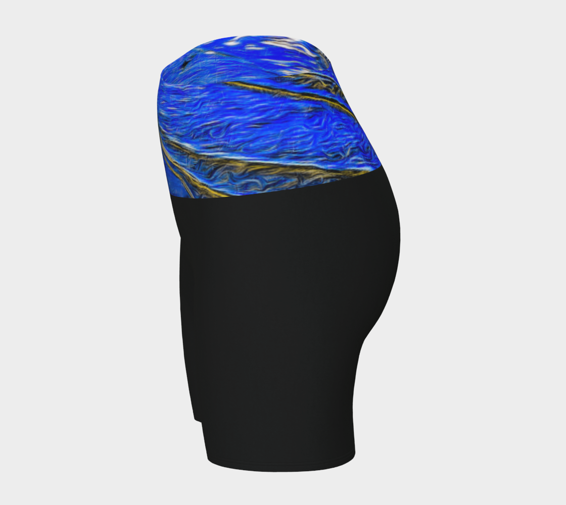 Ebb and Flow Yoga shorts feature a image of the ocean water at low tide with the sky and the sun reflecting on the water. This image is printed on the band of the yoga shorts.  The bottom of the shorts are black.