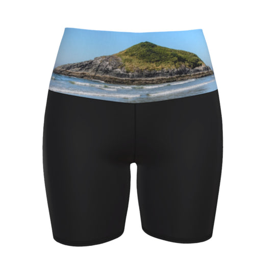 Lovekin rock long beach tofino image is printed on the waist band of the yoga shorts.  The rest of the shorts is black.