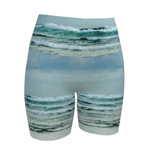 This all over printed Ocean Calling Tofino yoga shorts features an image of the waves at Long Beach Tofino.