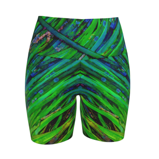 Shades of green yoga shorts feature an all over print of spring ocean sea grass at low tide.