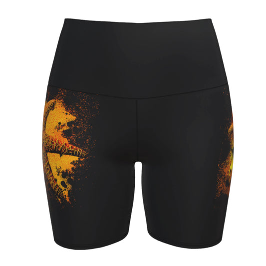 Starfish Orange Yoga Shorts features a orange starfish on a bed of abstract sand on black shorts.