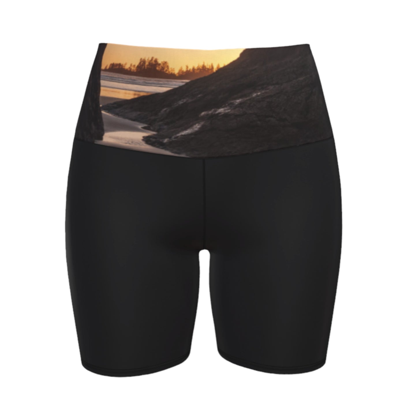 Tofino Sunset Yoga Shorts features an image of a sunset at long beach tofino printed on the waistband. the rest of the shorts are black.