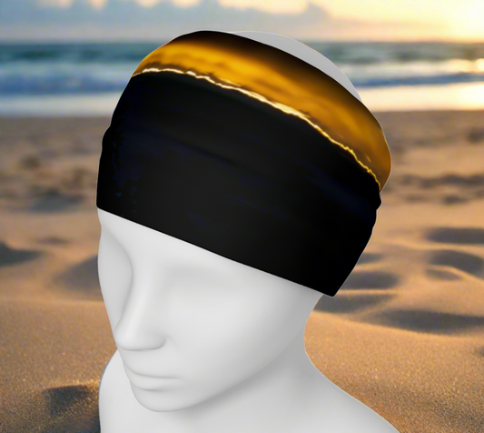 Headband and or neck gaiter features a image of a eagle perched high up in a tree as the sun sets over Parksville.