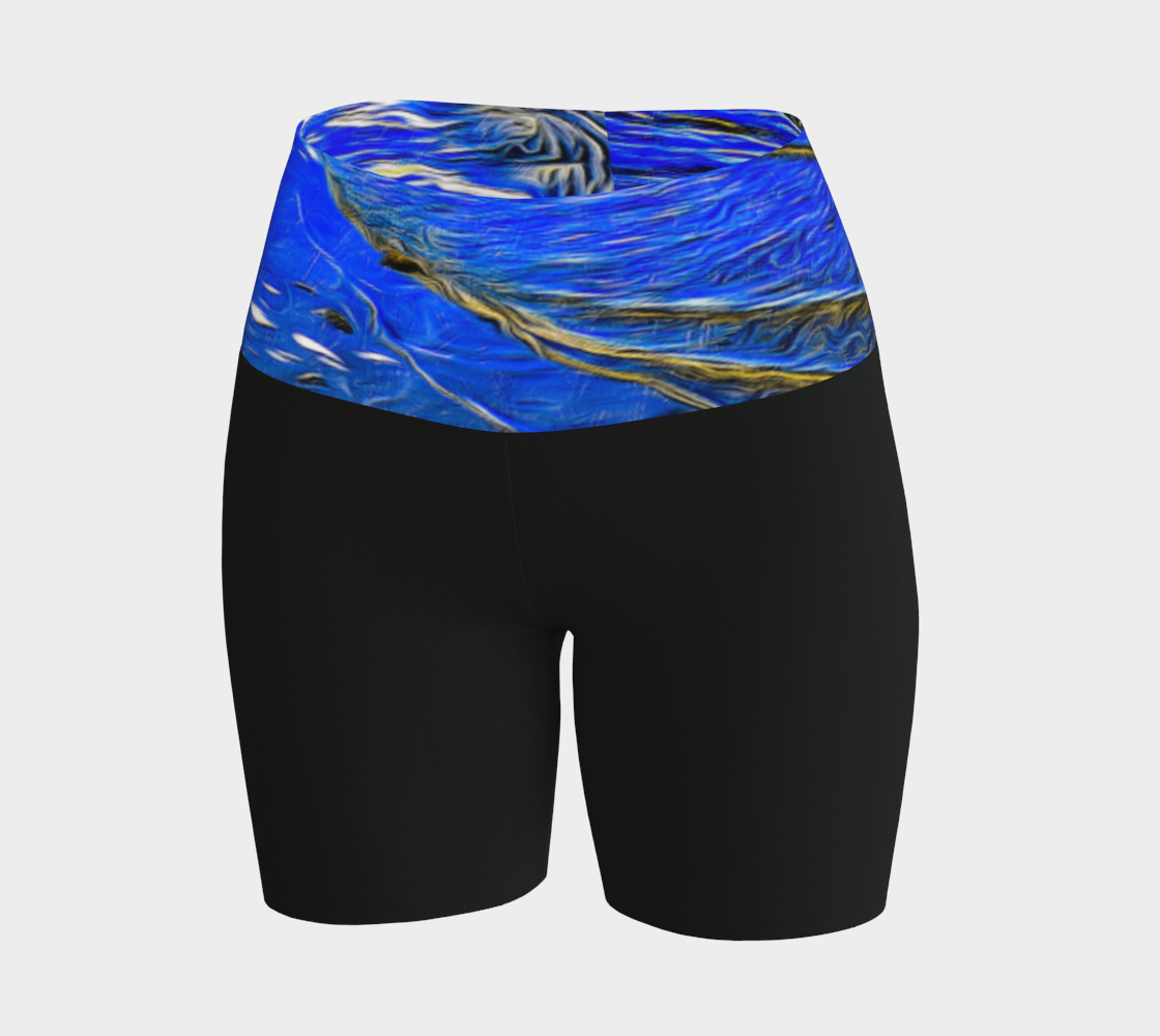 Ebb and Flow Yoga shorts feature a image of the ocean water at low tide with the sky and the sun reflecting on the water. This image is printed on the band of the yoga shorts.  The bottom of the shorts are black.