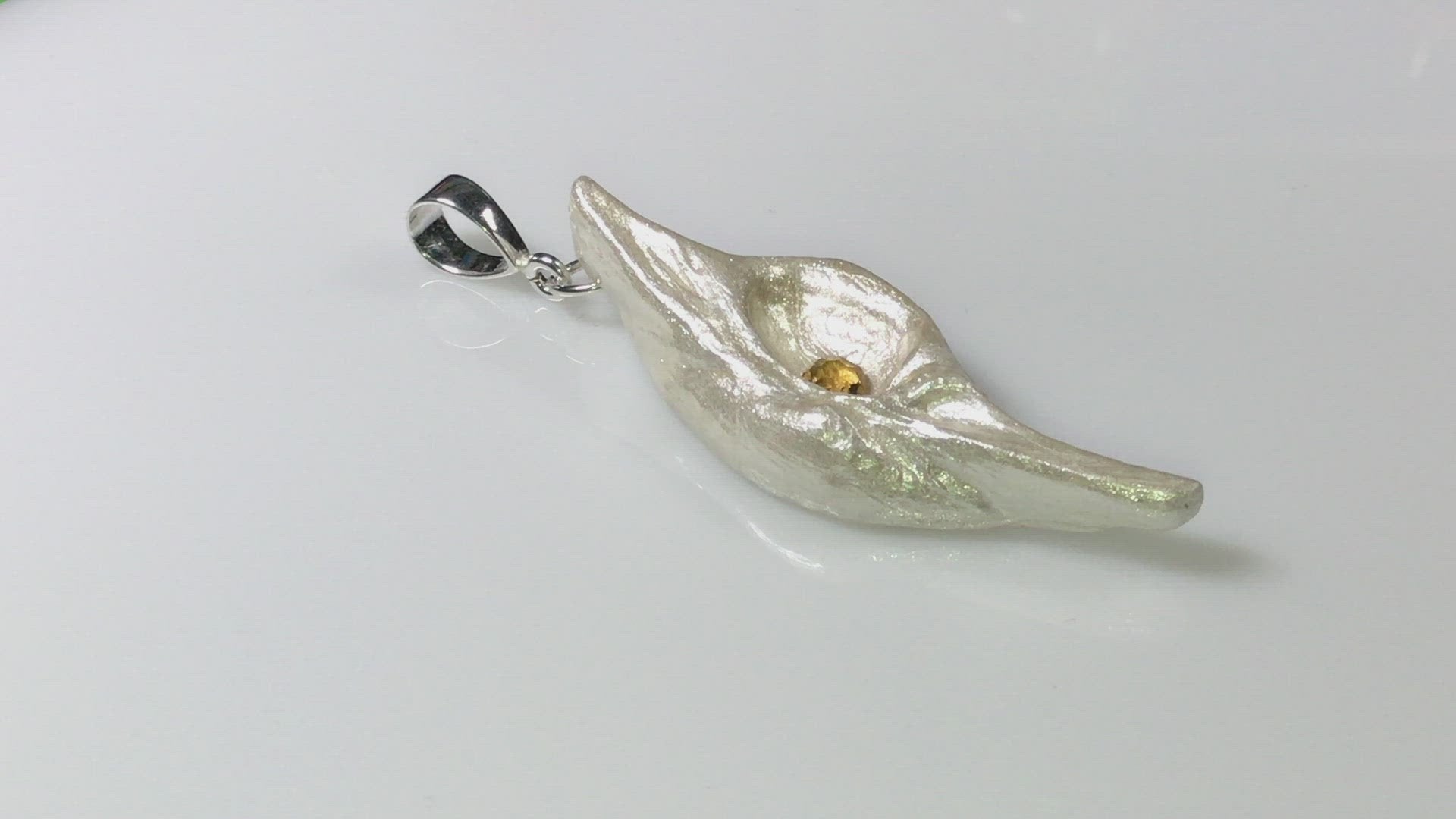 A video Lightmaker natural seashell pendant A beautiful pear shaped rose cut Citrine compliments the pendant.